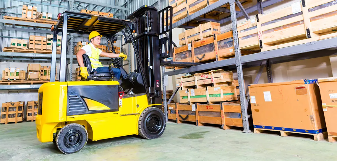 Forklift worker in warehouse